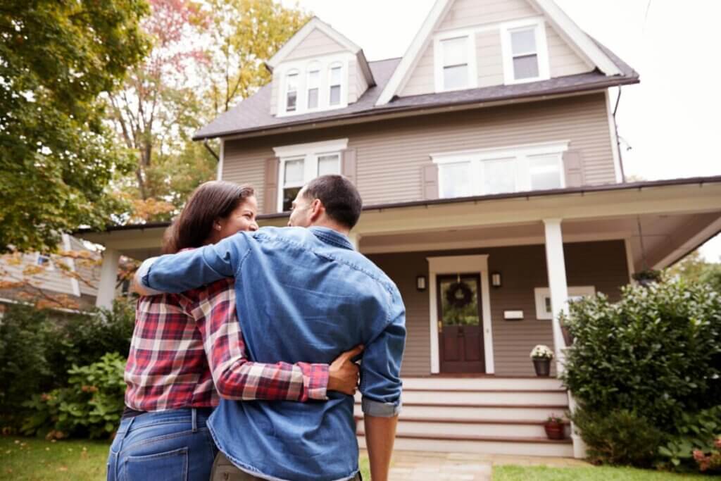 homeowners admiring their home